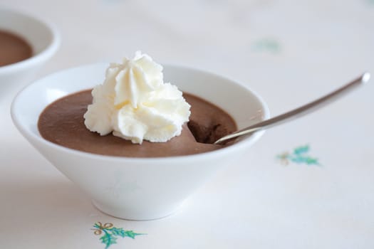 Small bowl with chocolate mousse and whipped cream