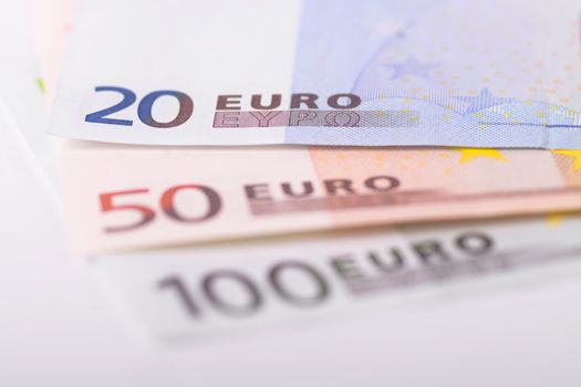 Various euro banknotes with selective focus on 20