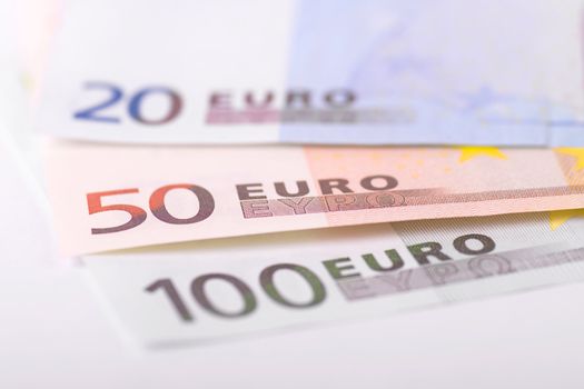 Various euro banknotes with selective focus on 50