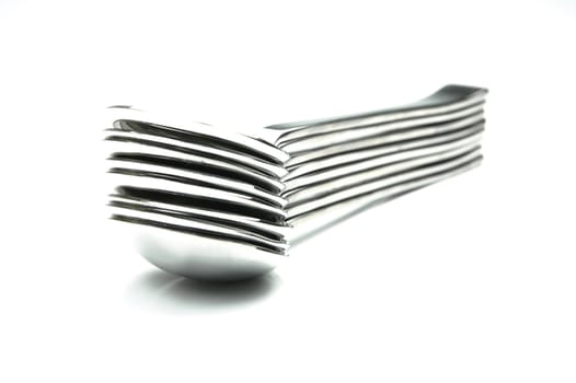 Silver desert spoons isolated against a white background