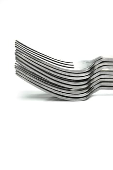 Silver table forks isolated against a white background