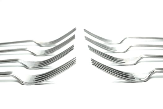 Silver table forks isolated against a white background