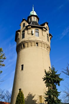 Old stone tower standing on city suburb