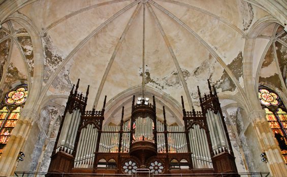 Under a dome the stone arches in old the church sounds dark body