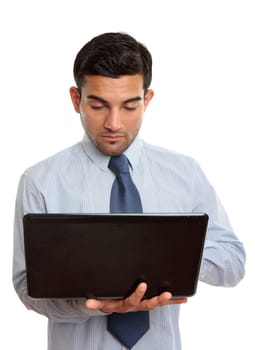 Businessman using a laptop computer.  White background.