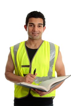 A male construction worker or other labourer holding a book and pen.  He is looking up and smiling.  White background.