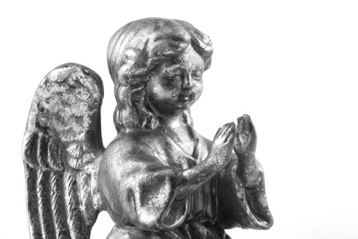Little angel praying, isolated on white.