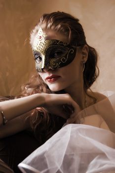 beautiful woman in mask looking mysterious