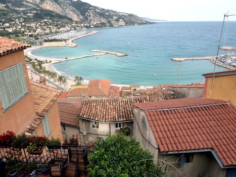 View of Menton port and seaside, south of France, upon the red roofs of the old city