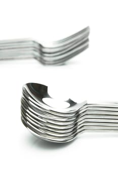 Forks and spoons isolated against a white background