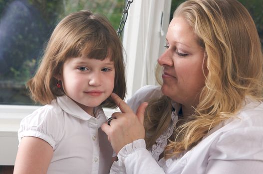 Young Mother and Daughter Enjoying a Personal Moment