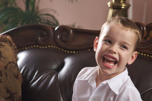 Adorable Young Boy with Blue Eyes Smiles for the Camera