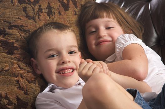 Brother and Sister Having Fun on the Couch