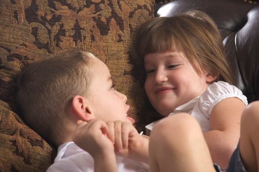 Brother and Sister Having Fun on the Couch