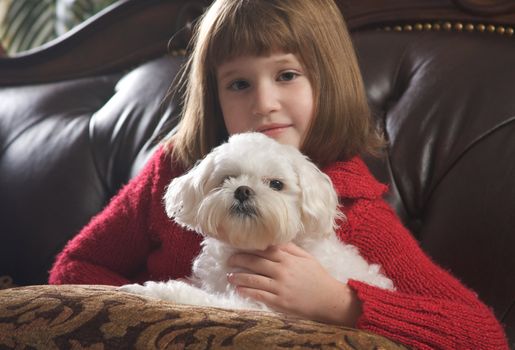 Young Girls Poses with Her Maltese Dog