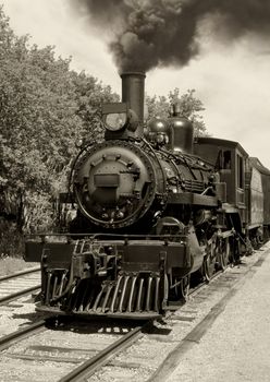 Image of an old locomotive done in sepia. Scanned film.