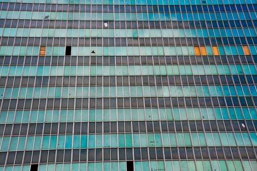 Rundown office building with broken out windows