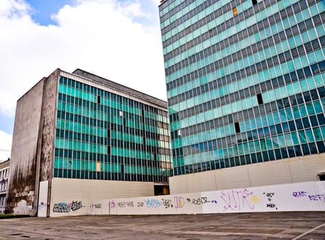 Rundown office buildings with broken out windows