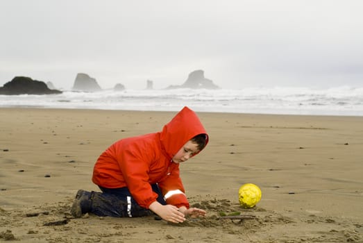 boy playing on beach, Oregon Coast