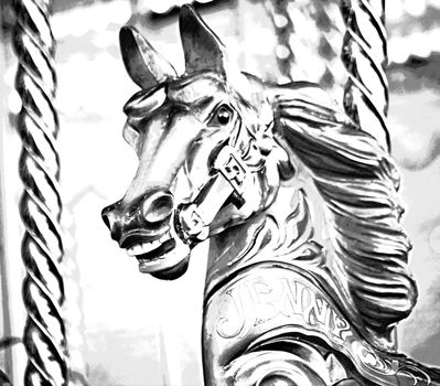 A wooden horse on a carousel ride