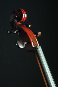 detail of cello on black background