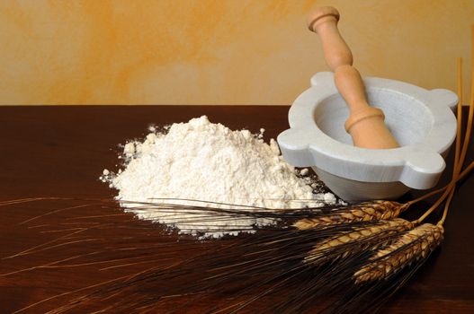 Flour, wheat ears wooden table