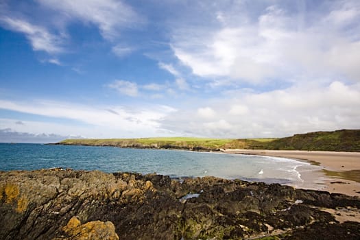 A rocky beach in a pretty bay