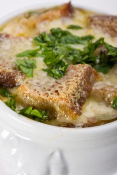 onion soup scalloped with cheese in a soup pot