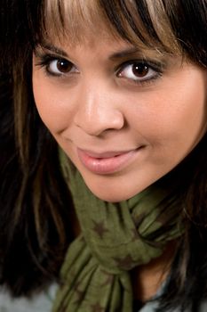 A young hispanic woman with blonde highlights in her hair.