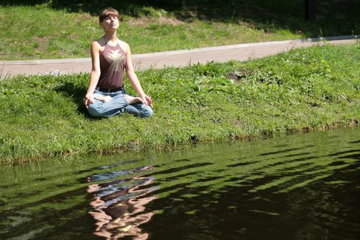 beautiful girl, meditation near by water