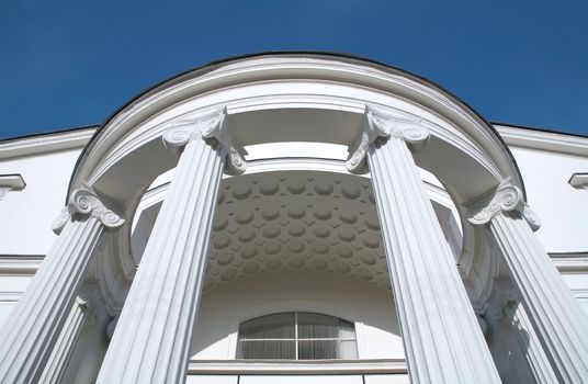 fragment old-time brightly white building on background blue sky, theatre "Sovremennik" on Chistye Prudy, Moscow, Russia, editorial use only