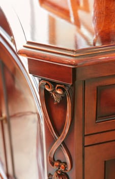 fragment of the luxurious brown dresser in modernist style, vintage