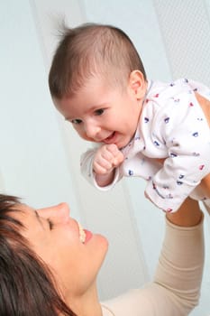 small smiling child on hand of the lucky ma