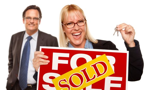 Man Behind with Attractive Blonde in Front Holding Keys and Sold For Sale Sign Isolated on a White Background.