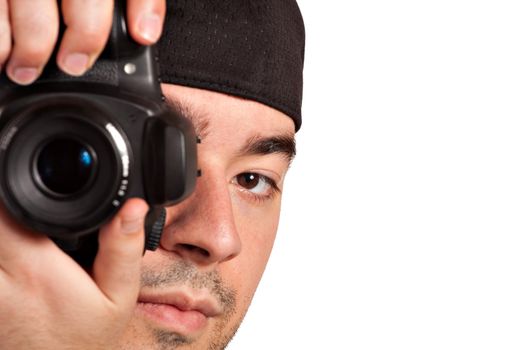 A young photographer taking a photo with his digital single lens reflex camera