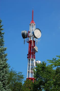 Upper fragment of antenna construction over blue sky