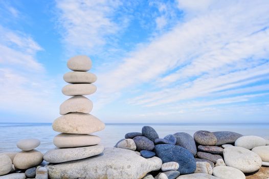 The stack of the pebbles on the background of the blue sky