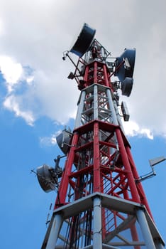 Upper fragment of antenna construction over blue sky