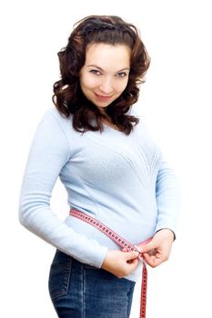 pregnant young woman measuring her belly