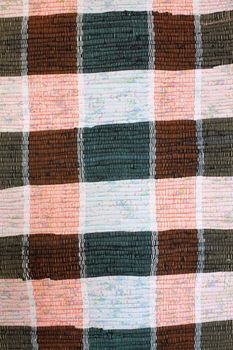 Surface of a colour ancient rural rug