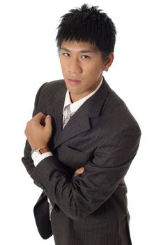 Strong businessman portrait, young Asian guy on white background.