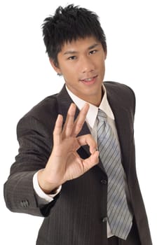 Ok gesture holding by young business man on white background.