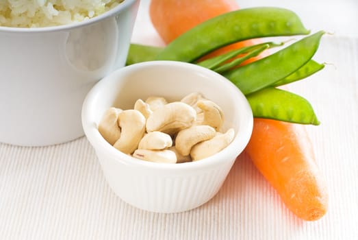 fresh cashew nut and vegetables,with steamed white rice ,typical ingredients of chinese cuisine