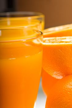 fresh and healthy orange juice ,unfiltered ,over a light table