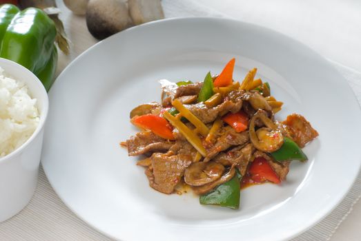 typical chinese dish,fresh beef stir fried with pepperrs bamboo sprout and mushrooms