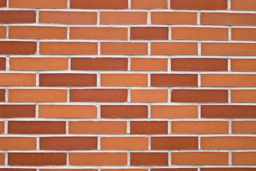 a brickwall with stones in shades of red and orange