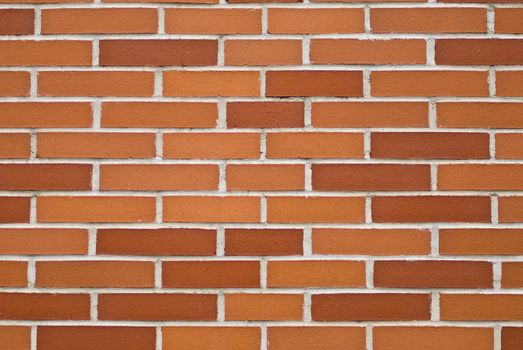 a brickwall with stones in shades of red and orange