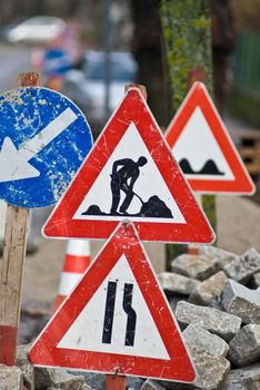 a construction site with a lot of street signs