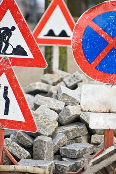 a construction site with a lot of street signs