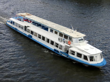 White large passenger steamboat moves along Moscow river